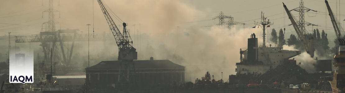 Southampton port, with clouds of smoke rising over it.