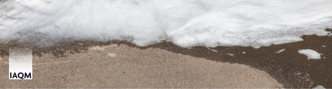 Foam flowing over concrete.
